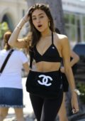 madison beer rocks a black sports bra with matching leggings while out with  a friend in los angeles-180419_16