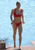 Michelle Hunziker goes for swim wearing a red bikini in Lake Garda, Gargnano, Italy