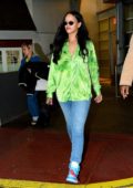 Rihanna stands out in a bright green shirt as she leaves a photoshoot in New York City