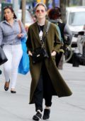 Rose Leslie steps out in an olive green trench coat with Nike sneakers while out and about in New York City