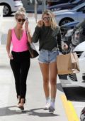 Sofia Richie keeps it trendy in long sleeve top and denim shorts while out for lunch with a friend in Malibu, California