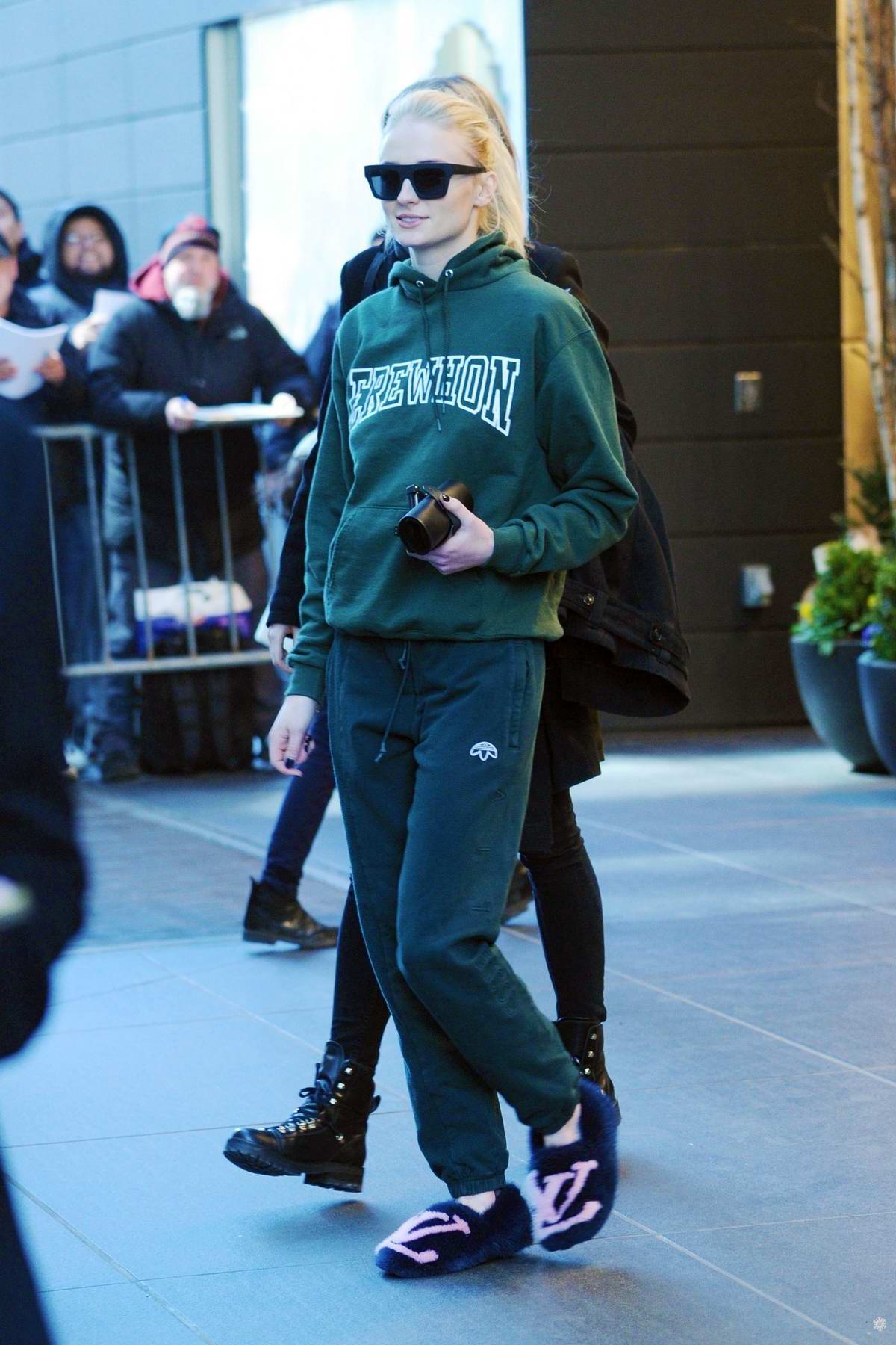 Sophie Turner steps out in green sweats and Louis Vuitton slippers