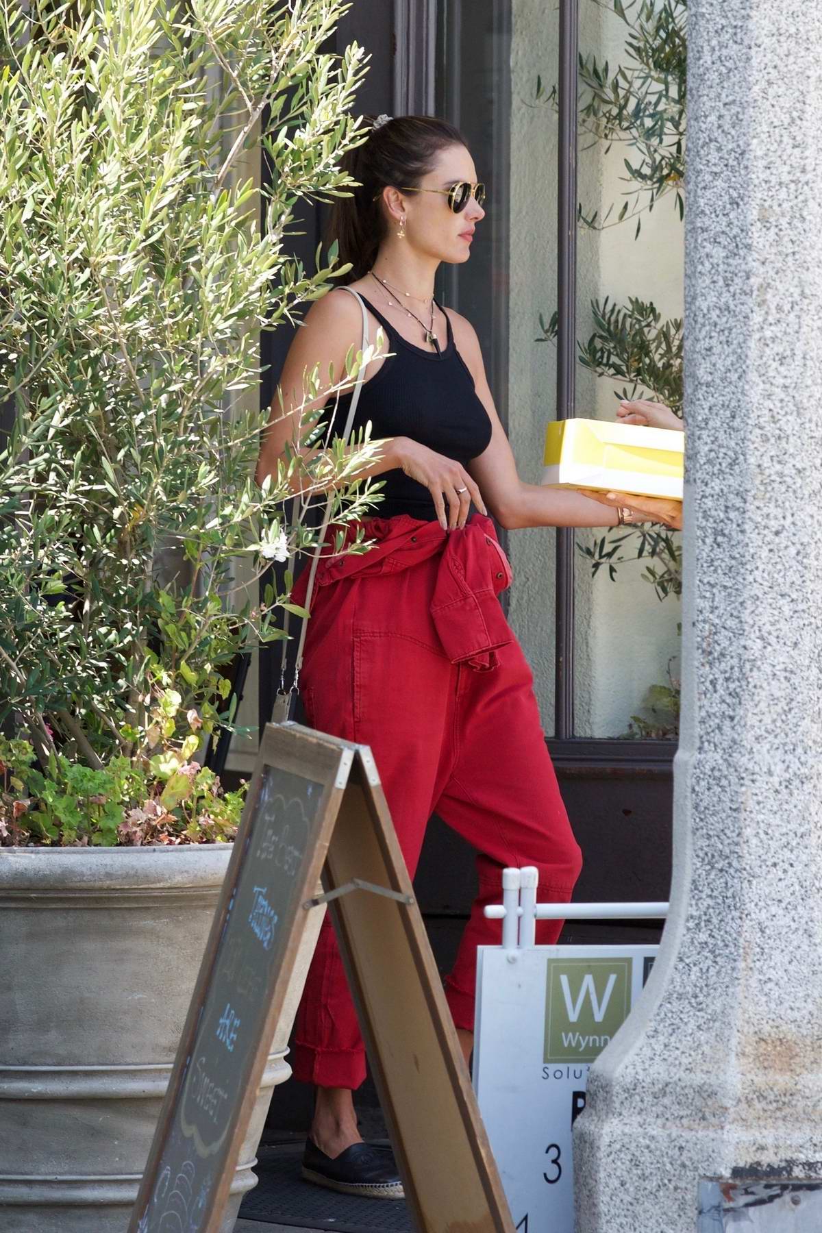 alessandra ambrosio rocks a black tank top and red denim while