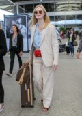 Elle Fanning looks fashionable in a cream pantsuit as she lands at the Nice Airport ahead of the 72nd Cannes Film Festival, France