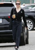 Emma Roberts wears a black cardigan and jeans while out for an iced coffee in Los Angeles