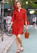 Karlie Kloss looks striking in a red button up dress and mini bucket bag in New York City