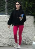 Lucy Hale sports a black hoodie and bright pink leggings as she heads to the gym in Studio City, Los Angeles