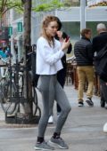 Suki Waterhouse sports white top and grey leggings as she leaves after a workout session in New York City