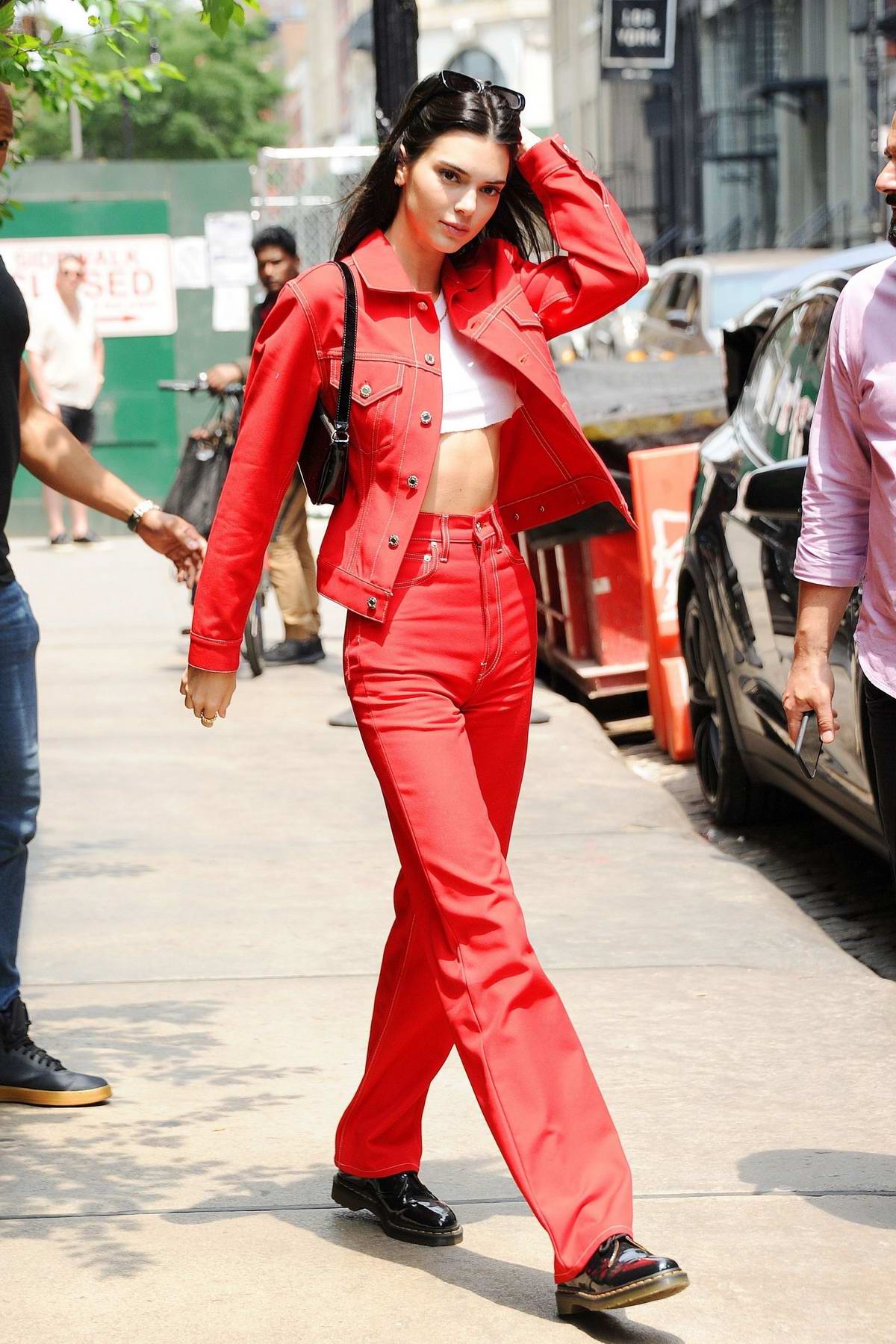Kendall Jenner turns heads as she steps out in a matching red denim outfit  in SoHo