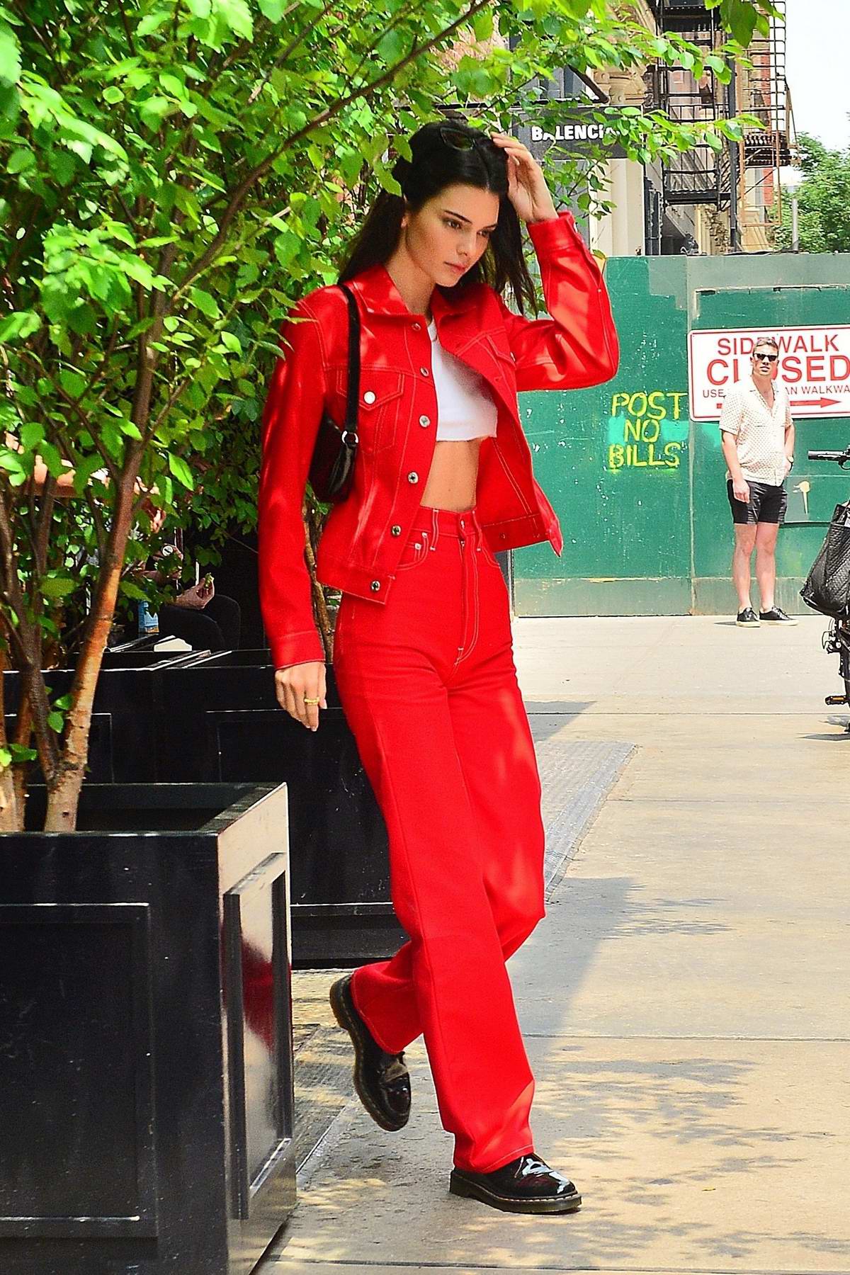 Kendall Jenner turns heads as she steps out in a matching red denim outfit  in SoHo