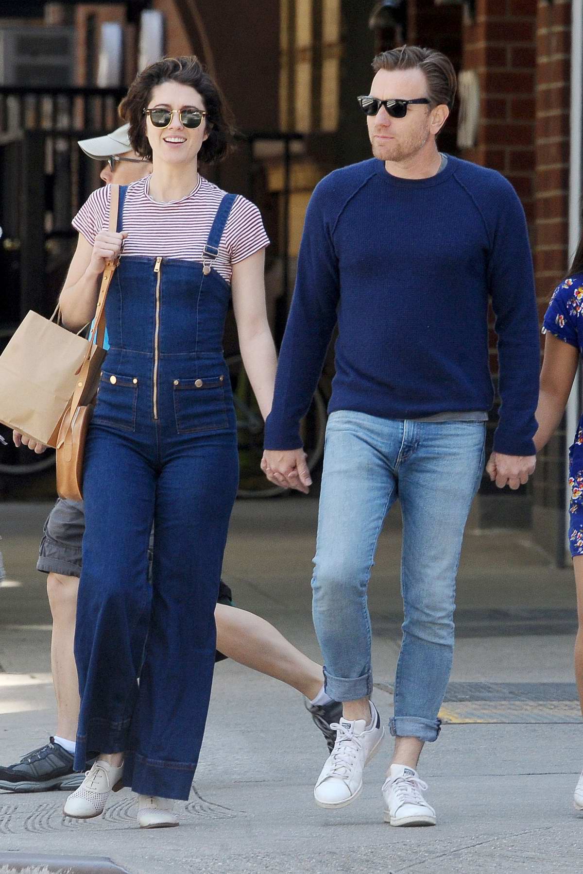 Mary Elizabeth Winstead and Ewan McGregor hold hands while on a stroll