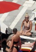 Pixie Lott relaxes by the pool in a polka dot swimsuit in Ibiza, Spain