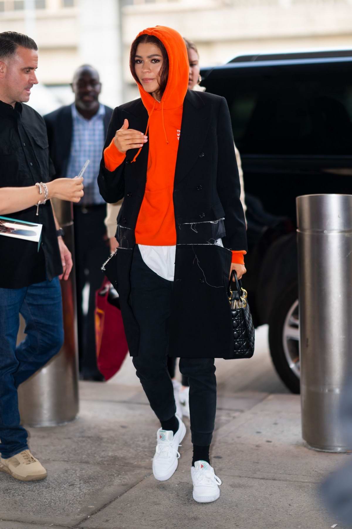 zendaya arrives in a red hoodie at jfk airport in new york city-250619_4