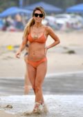 Audrina Patridge sports an orange bikini while relaxing on the beach in Santa Monica, California