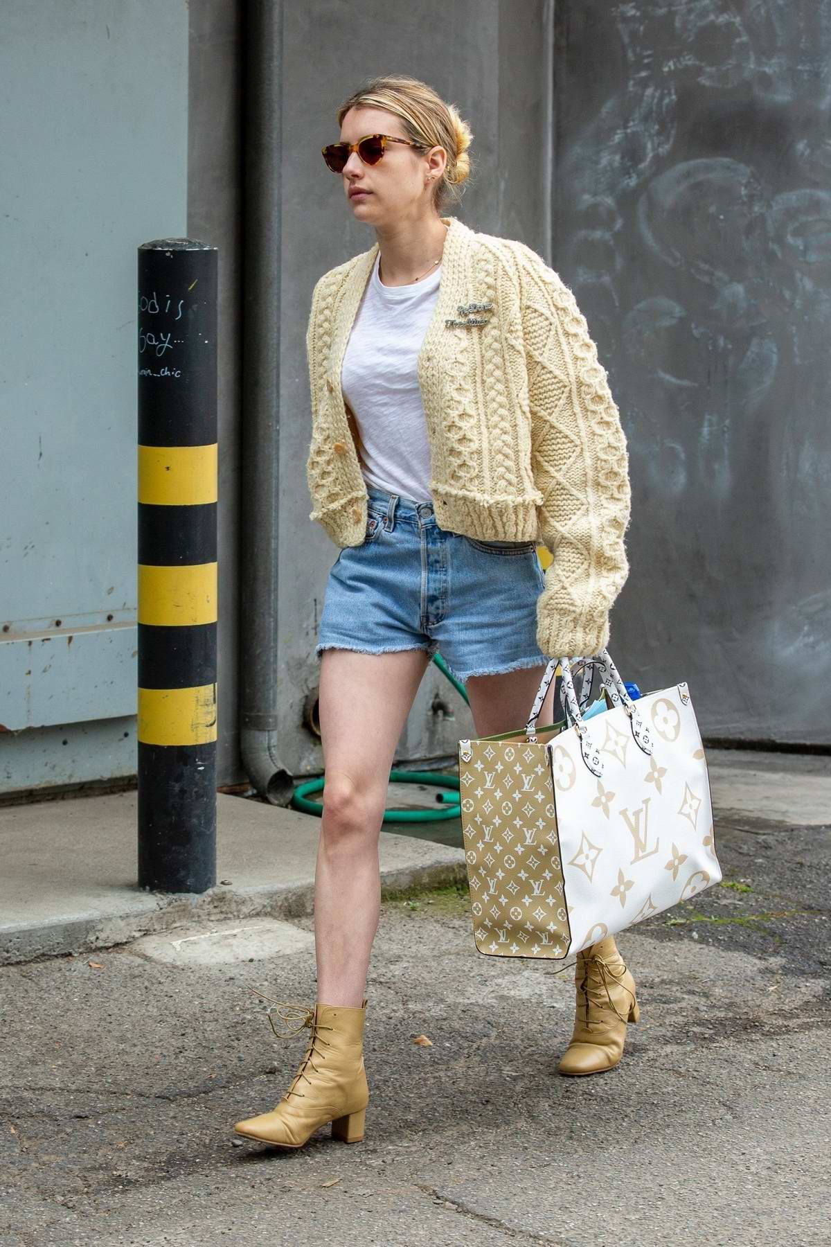 emma roberts wears a knitted yellow cardigan and denim shorts during a  shopping trip to louis vuitton in los angeles-080719_9