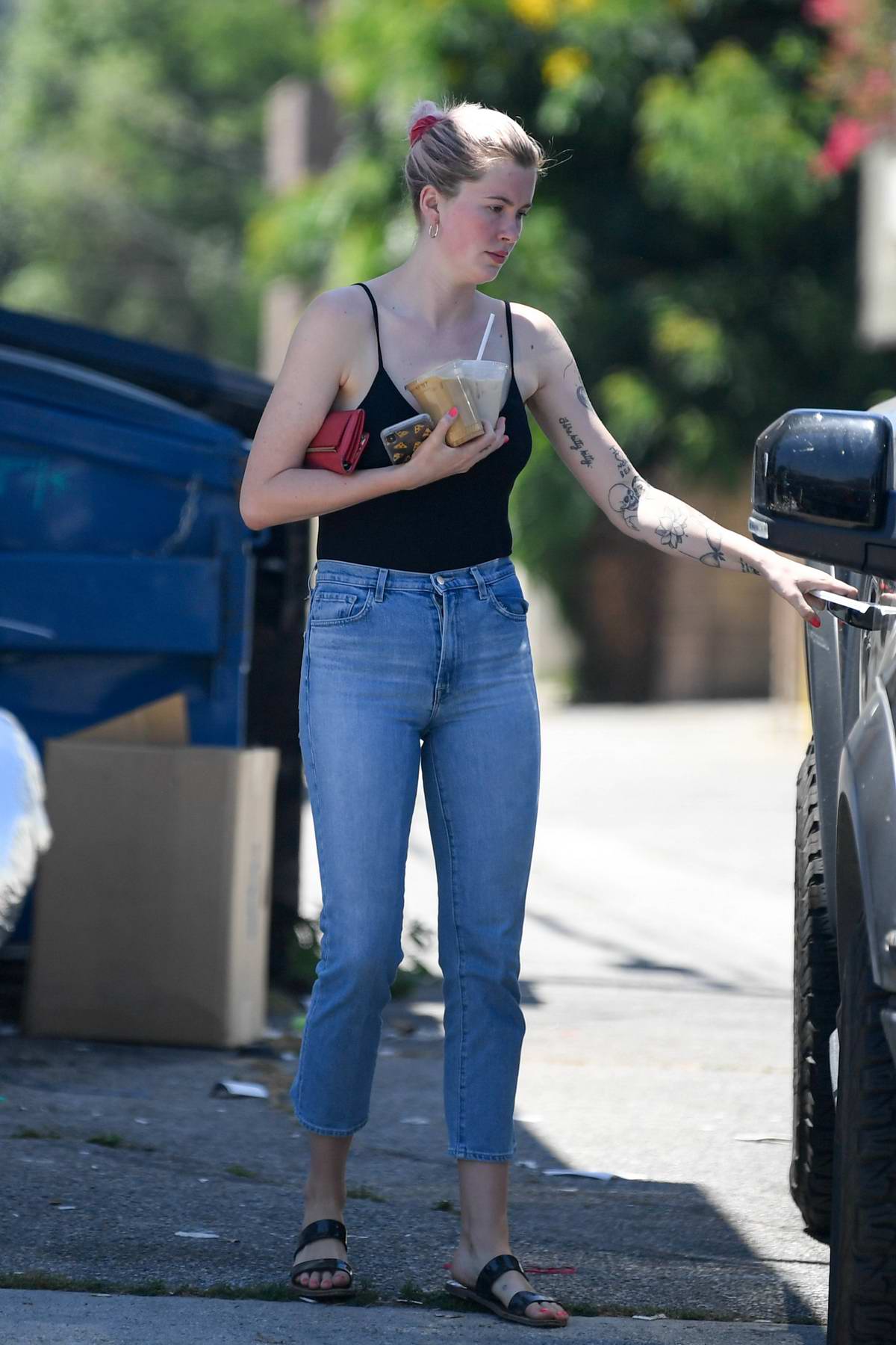 ireland baldwin wears a black camisole top and jeans while out for an ...