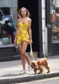 Kimberley Garner looks vibrant in a short yellow summer dress out in Chelsea, London