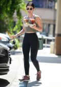 Lucy Hale wears a green tank top and black leggings during a coffee run at Coffee Bean in Studio City, Los Angeles