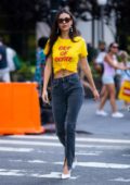 Victoria Justice seen wearing a yellow 'Out of Office' top while out for a stroll in New York City