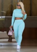 Blac Chyna sports baby blue crop top and matching leggings as she leaves an office building in Beverly Hills, Los Angeles