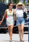 Irina Shayk seen wearing a neon green bikini while on vacation in Ibiza, Spain