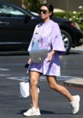 Kim Kardashian rocks her $35k Dior Saddle bag with an oversized lilac t-shirt and white sneakers as she steps out in Malibu, California