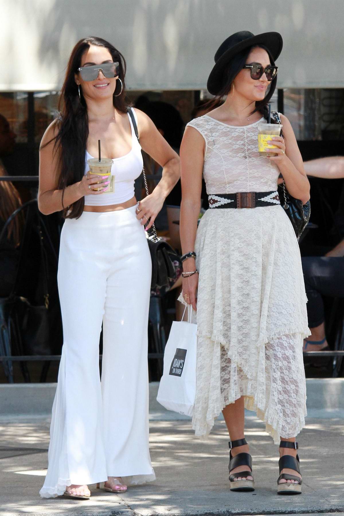 Nikki and Brie Bella step out in all-white ensembles for a lunch outing in  Studio