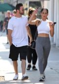 Nikki Bella wears a white crop top and grey leggings for a lunch