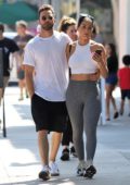 Nikki Bella wears a white crop top and grey leggings for a lunch date with Artem Chigvintsev in Studio City, Los Angeles