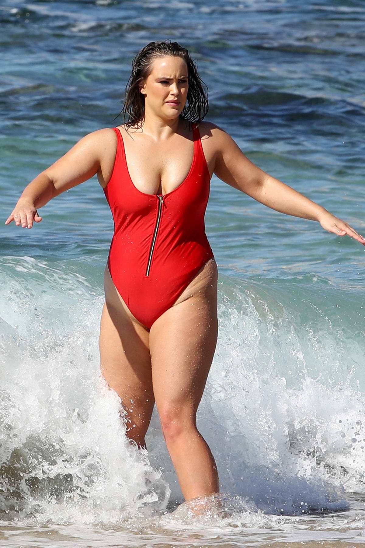 Elizabeth Hurley shows off her curves in teeny white bikini