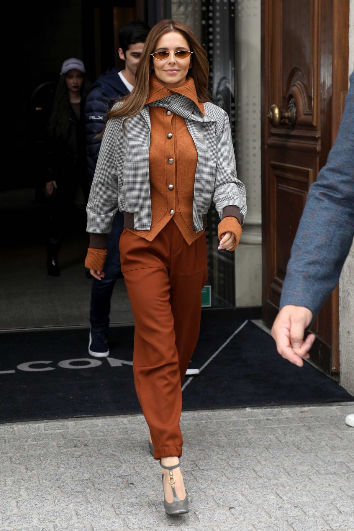 Cheryl Tweedy looks stylish as she leaves her hotel in Paris, France