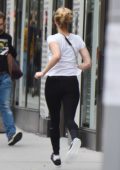 Jennifer Lawrence spotted in a white tee and black leggings while running a block on the Upper East Side in New York City
