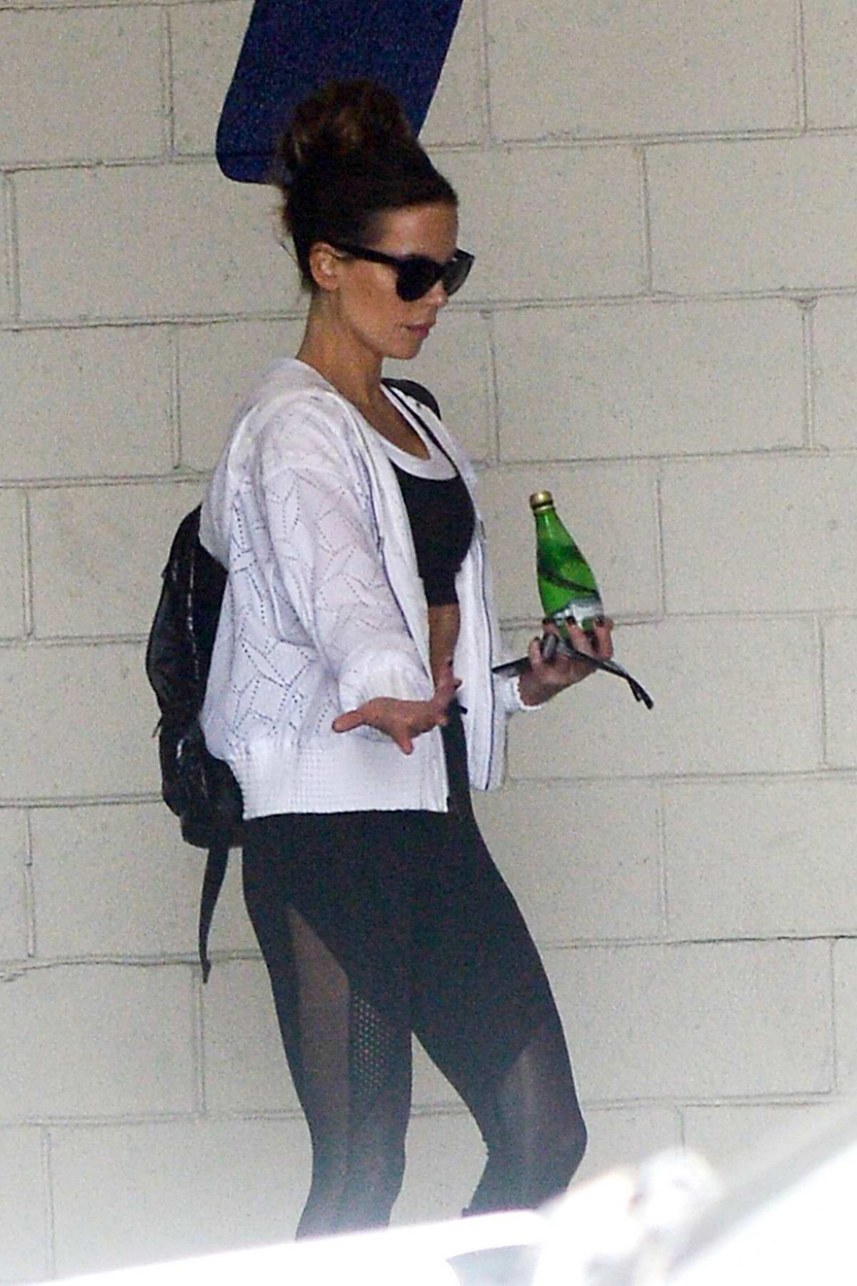 Kate Beckinsale wears a black sports bra with matching leggings
