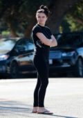 Ariel Winter keeps it casual in a black tee and leggings while running errands in Los Angeles