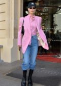 Bella Hadid looks stylish in a pink blazer and matching shirt as she leaves her hotel in Paris, France