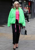Dua Lipa stands out in a bright green jacket as she leaves Capital Breakfast Radio Studios in London, UK