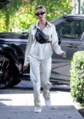 Hailey Bieber looks casual chic in silk outfit paired with a Louis Vuitton fanny pack while out running errands in Los Angeles