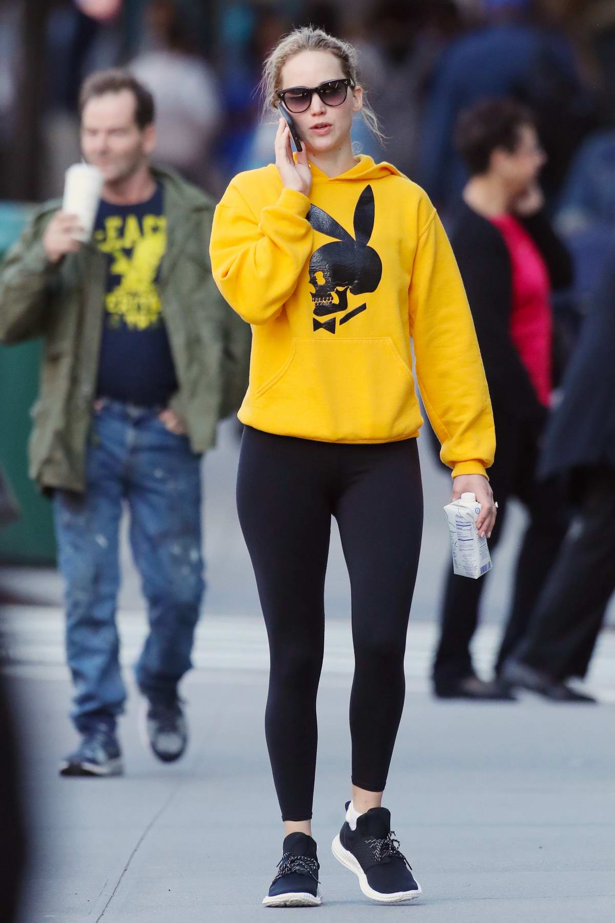 Jennifer Lawrence rocks a bright yellow hoodie and black leggings while  heading to the gym in