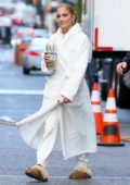 Gigi Hadid wears an off-shoulder white sweater and red leggings while  visiting Taylor Swift in