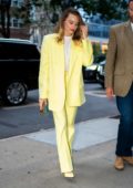 Margot Robbie stuns in a bright yellow suit as she steps out in New York City