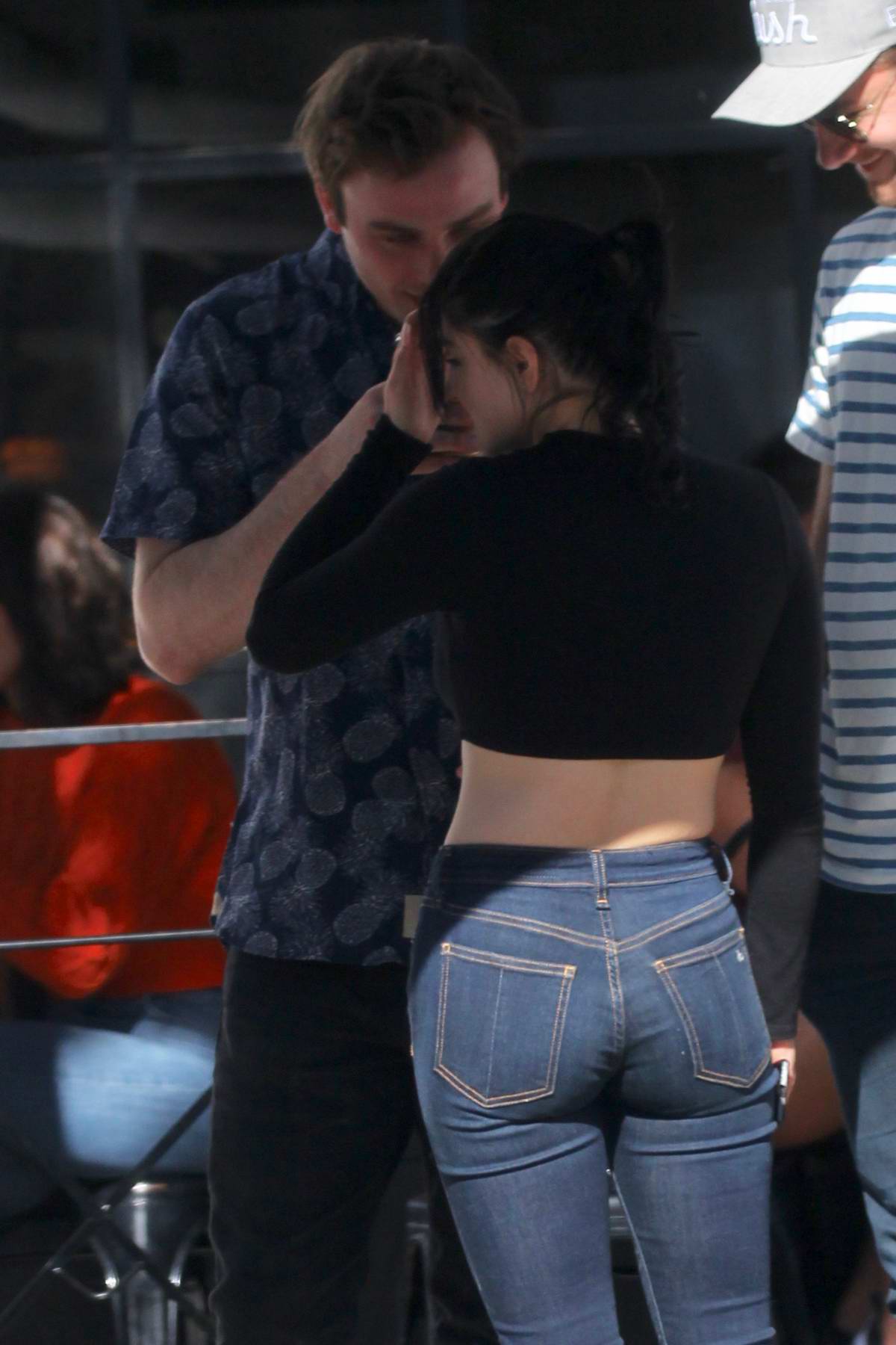 ariel winter bares her midriff in a black crop top and jeans during a