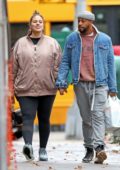 Ashley Graham shows her growing baby bump while out with her husband Justin Ervin in New York City