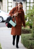 Katherine Schwarzenegger is all smiles as she leaves a Leclaireur store wearing a fuzzy brown coat in Los Angeles