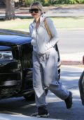 Khloe Kardashian sports a grey hoodie with matching sweatpants as she steps out in Calabasas, California