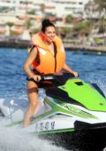 Alexandra Cane sports a green bikini as she rides the jet ski while on holiday in Tenerife, Spain