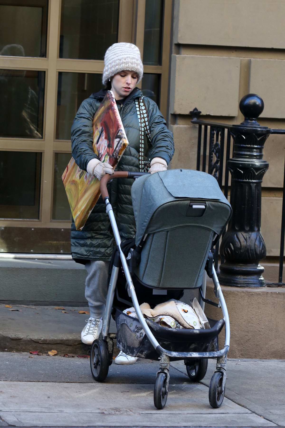anna kendrick seen while filming a scene with a baby stroller for 'love ...