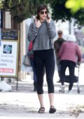 Dakota Johnson sports a grey hoodie and black leggings as she leaves her yoga class in Studio City, California