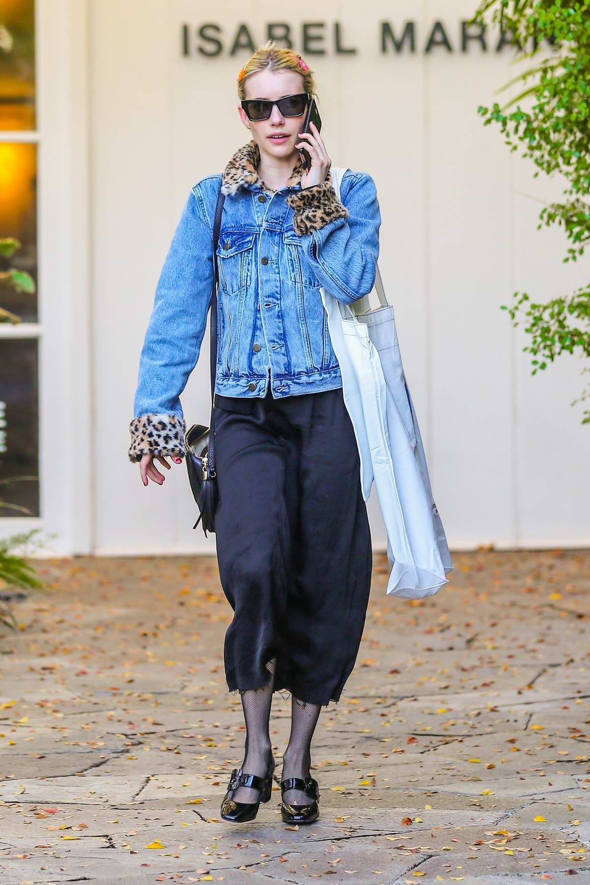 Emma Roberts looks stylish in a denim jacket while shopping on Melrose ...