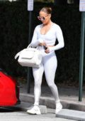 Jennifer Lopez looks fab in a white crop top with matching leggings and trainers as she hits the gym in Miami, Florida