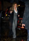 Jennifer Lopez looks stylish in a grey suit and black trench coat as she heads to dinner in New York City